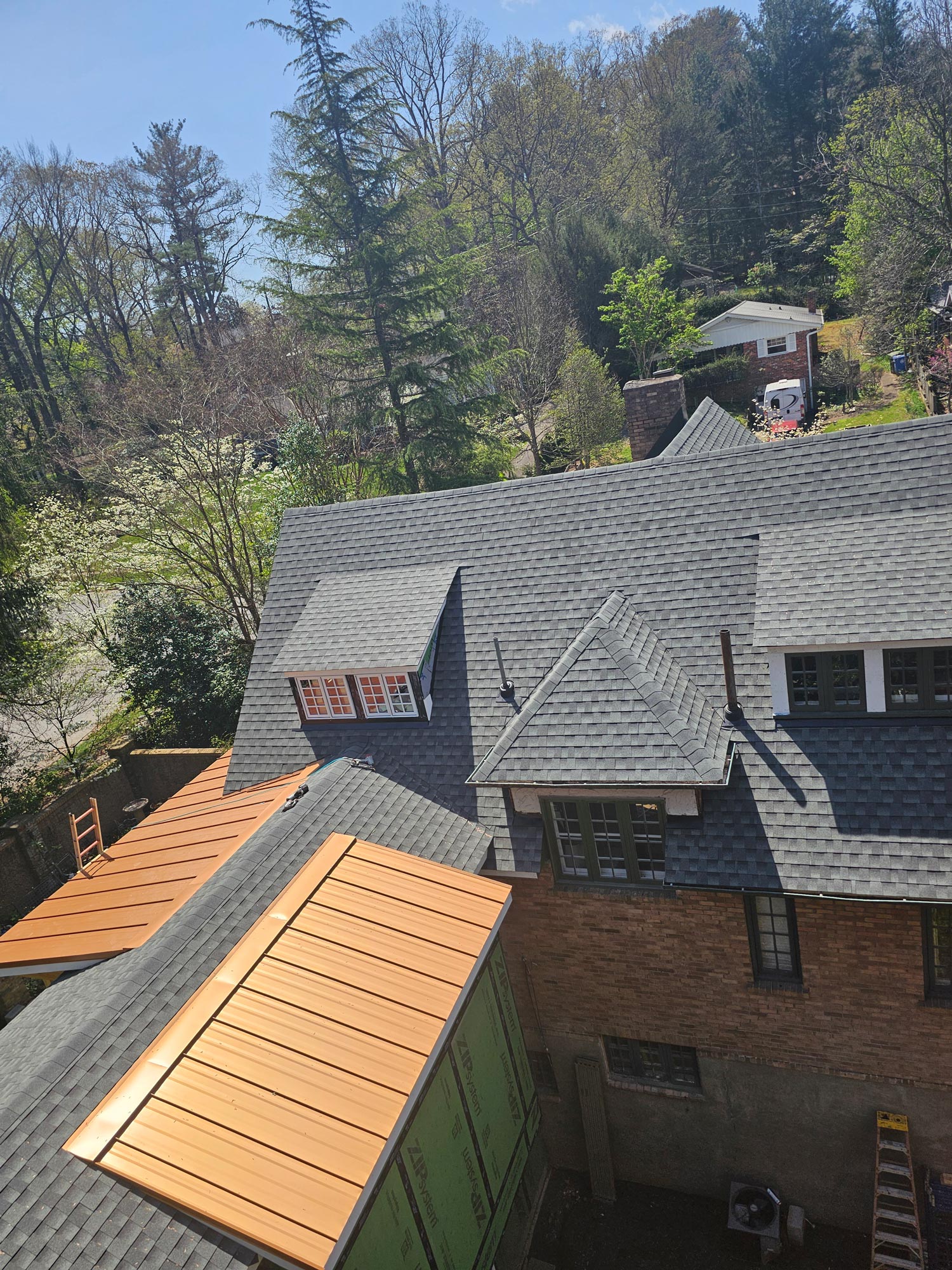 Metal roof with asphalt roof on Asheville home with new kitchen addition Metal roof with asphalt roof on Asheville home with new kitchen addition