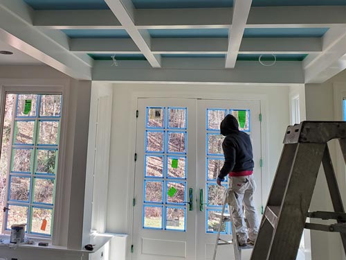 Painting the trim for the windows and doors