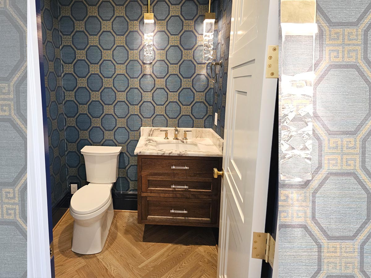 Powder room bathroom design ideas in 2025 with statement wallpaper, herringbone wood flooring, floating vanity