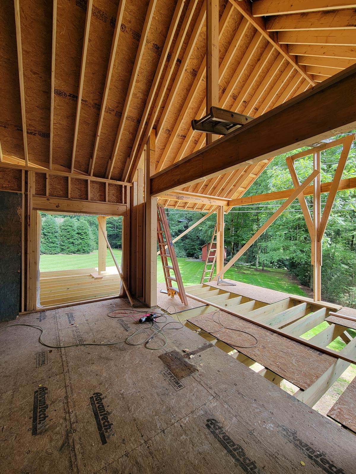 View from the newly framed living room with vaulted ceilings