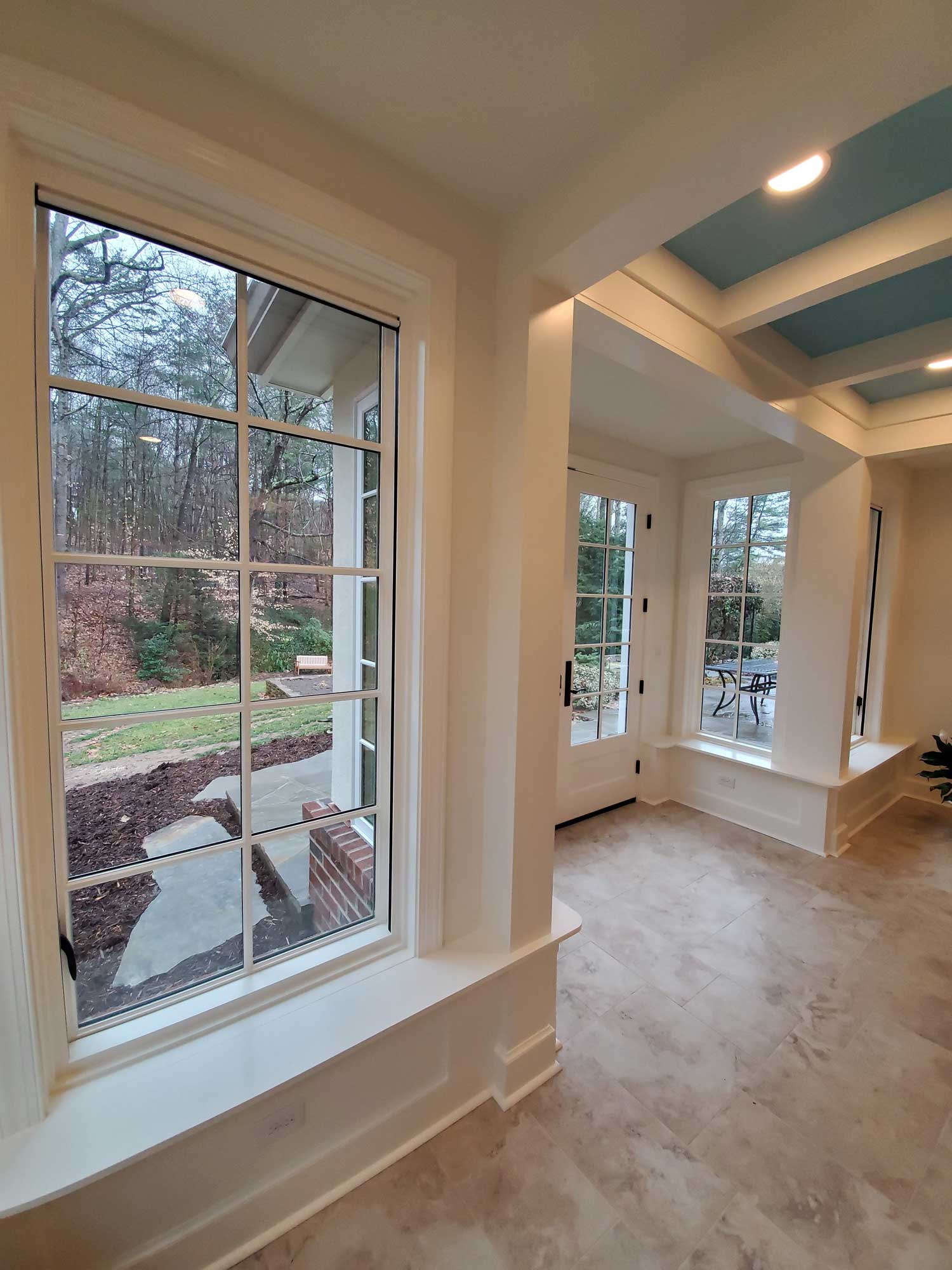 Millwork and trim around new doors and windows in sunroom addition Millwork and trim around new doors and windows in sunroom addition