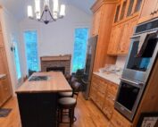 New addition with relocated kitchen custom hickory cabinets and keeping room