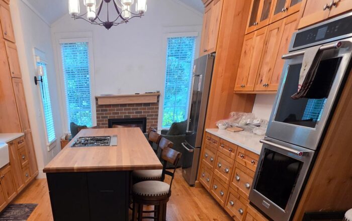 New addition with relocated kitchen custom hickory cabinets and keeping room