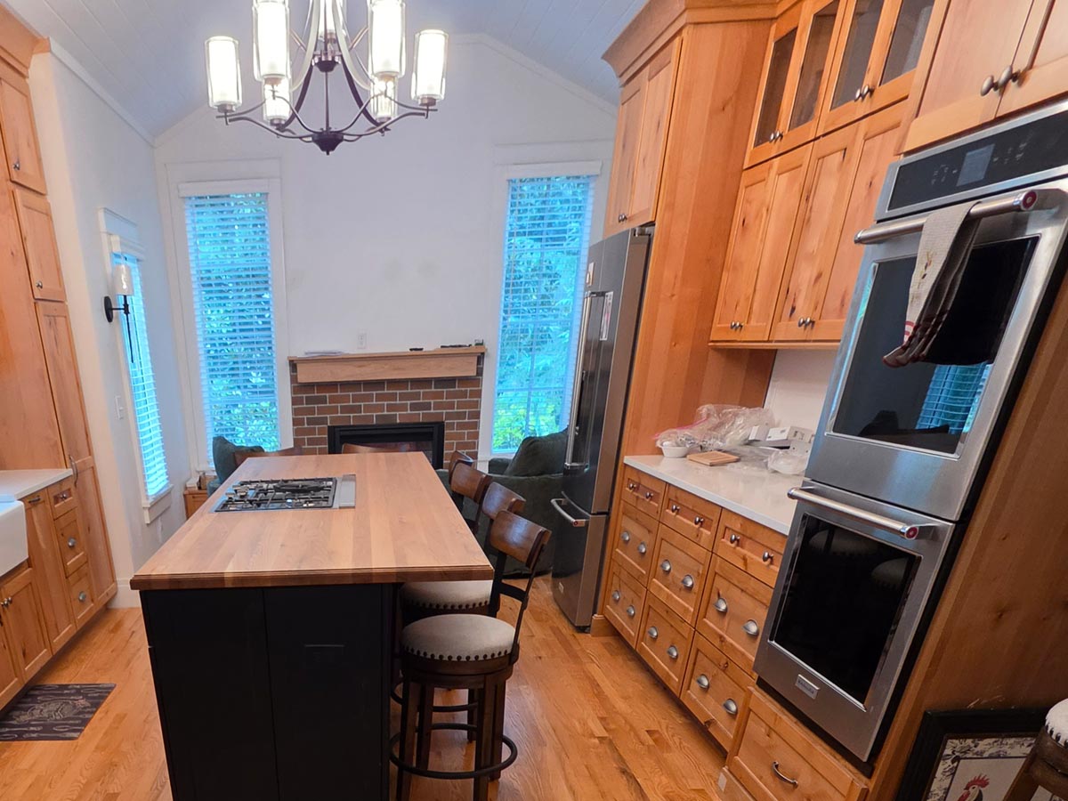 New addition with relocated kitchen custom hickory cabinets and keeping room