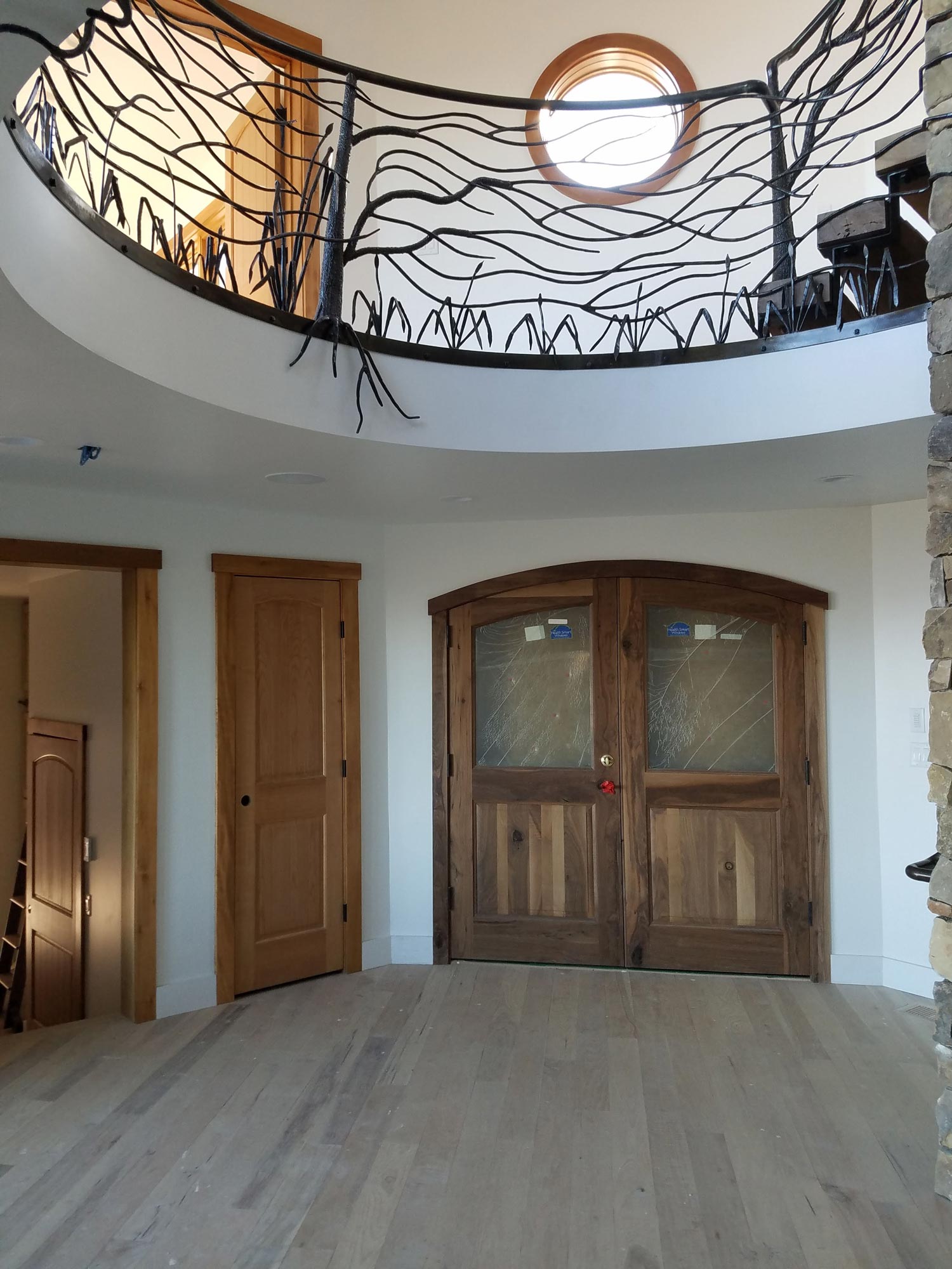 View of custom metal railing in open rotunda foyer above front door View of custom metal railing in open rotunda foyer above front door